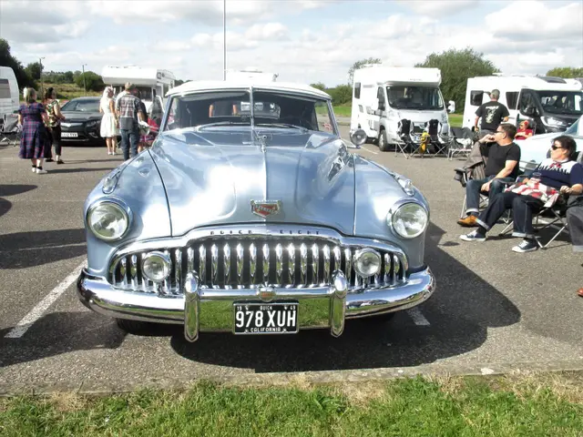The silver Buick's chrome grille